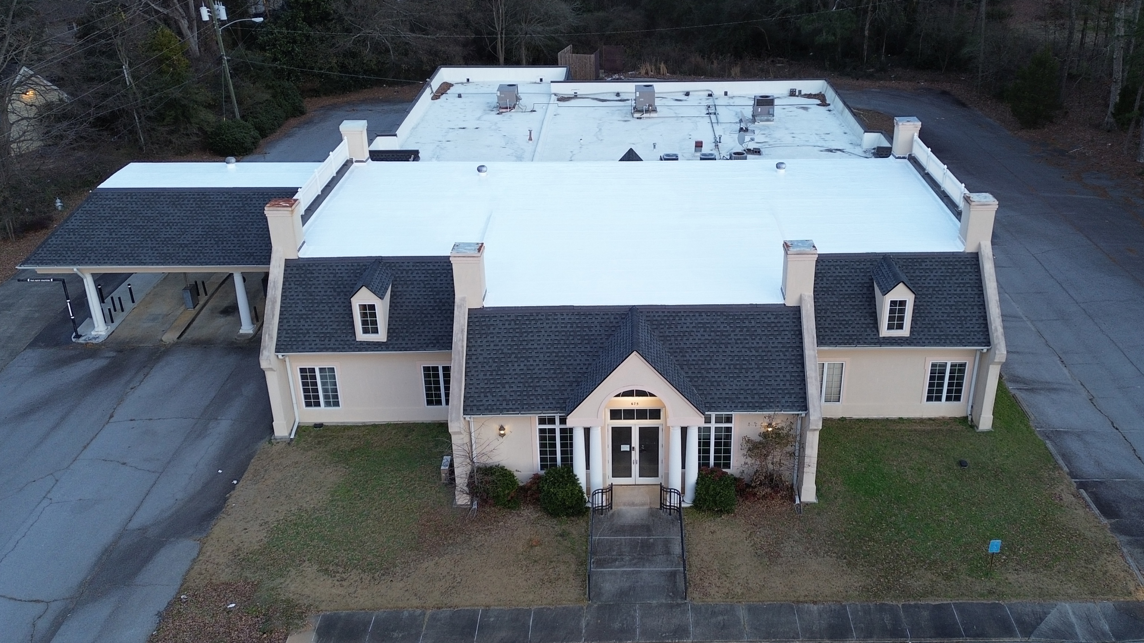 Silicone on modified bitumen roof